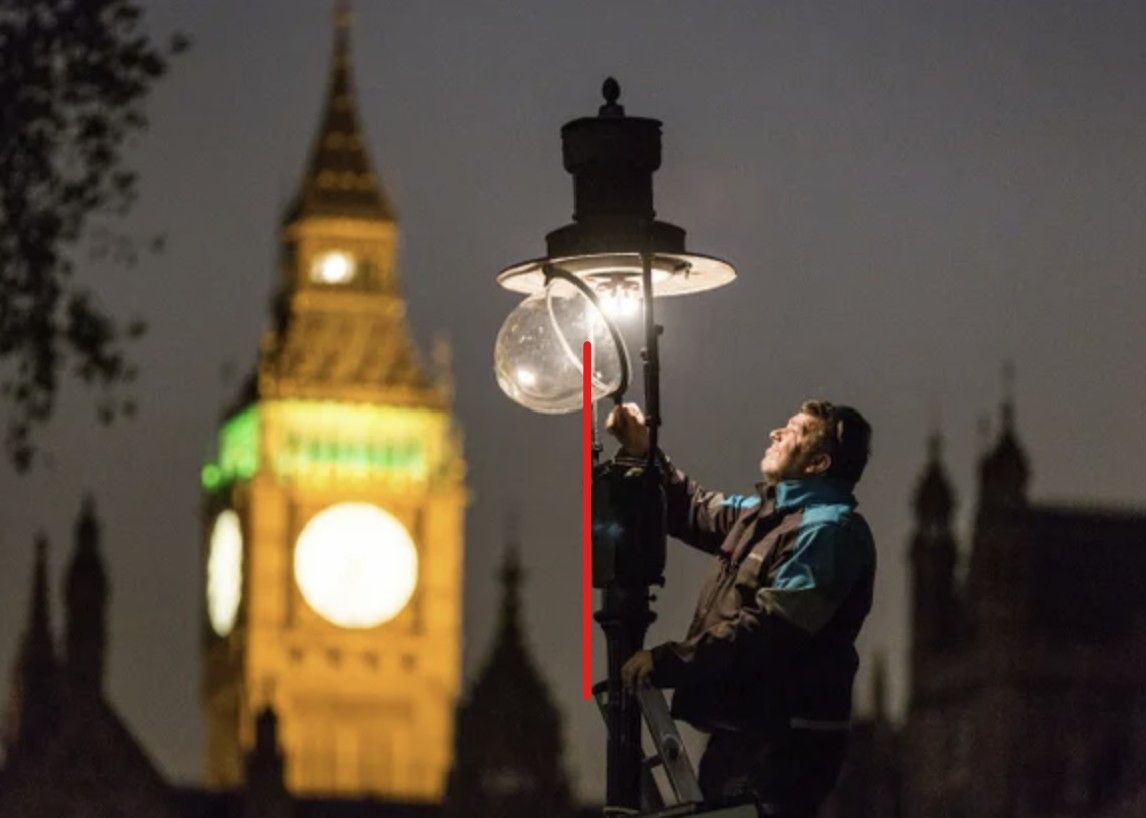 Image of lamplighter and lamp in front of Big Ben